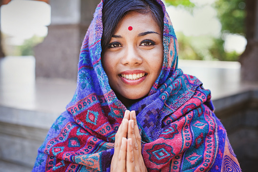 image of a Nepalese woman doing Namaste