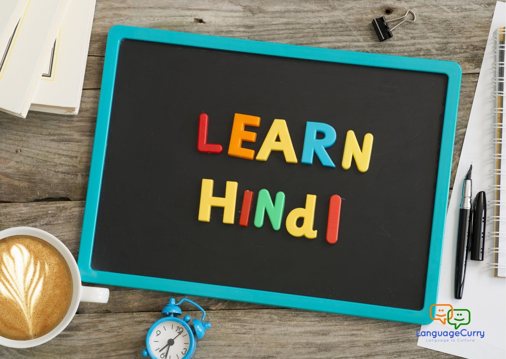 Learn Hindi written on a small black board