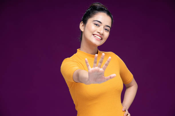 Image of a girl extending out her hand to say STOP used for Telugu slang word Lolli aapu