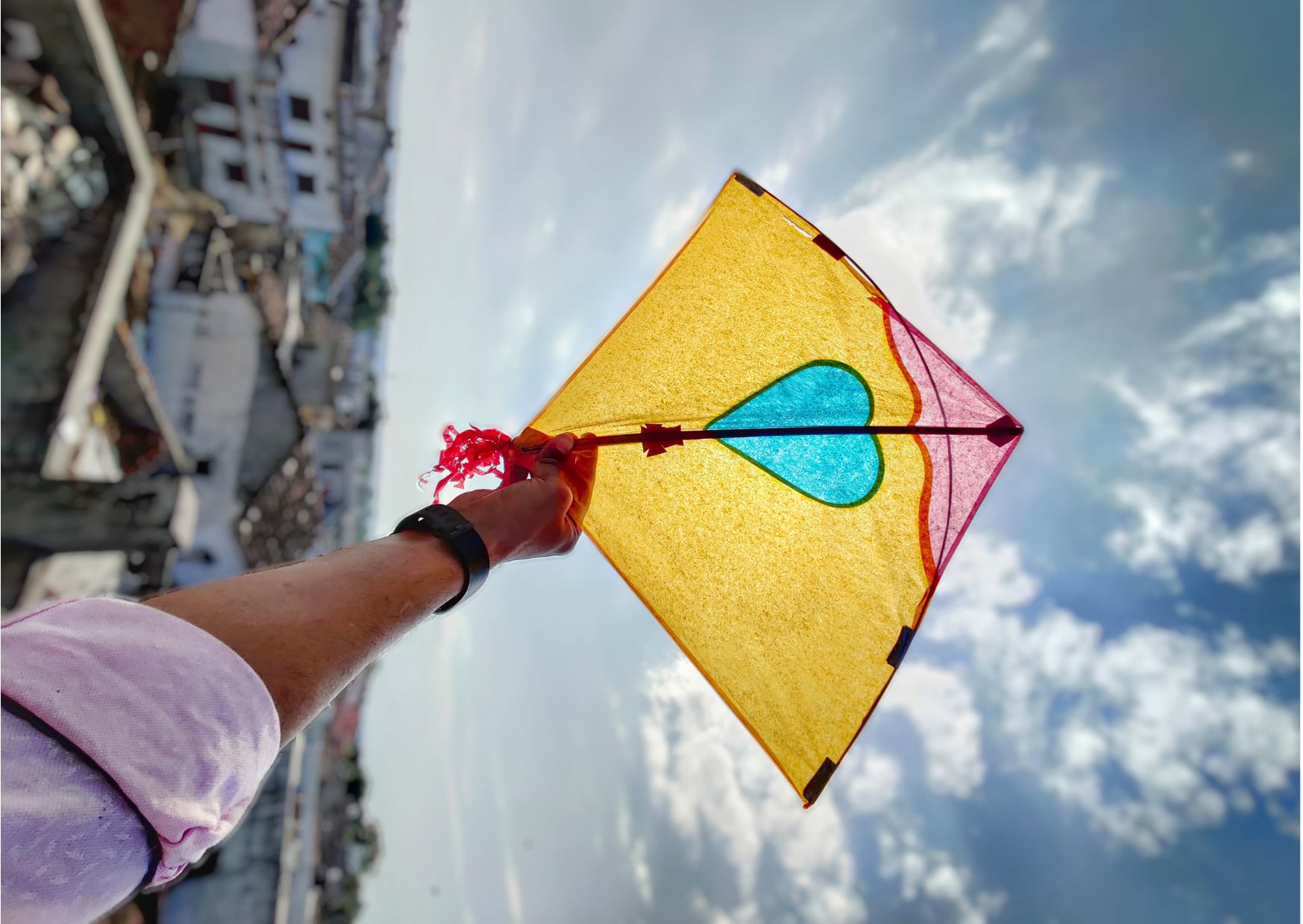 Uttrayan in Gujarat: a hand holding a kite 